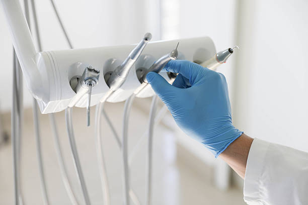 Professional Tooth Extraction technician working in Rapid City, MI